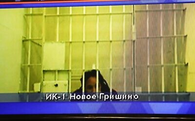 WNBA star and two-time Olympic gold medalist Brittney Griner is seen on the bottom part of a TV screen as she waits to appear in a video link provided by the Russian Federal Penitentiary Service a courtroom prior to a hearing at the Moscow Regional Court in Moscow, Russia, October 25, 2022. (AP Photo/Alexander Zemlianichenko)