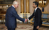 King Charles III (right) welcomes Rishi Sunak during an audience at Buckingham Palace, London, where he invited the newly elected leader of the Conservative Party to become prime minister and form a new government, October 25, 2022. (Aaron Chown/Pool photo via AP)