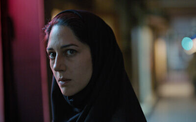 This image released by Utopia shows Zar Amir Ebrahimi in a scene from "Holy Spider." Ebrahimi stars as a journalist investigating a serial killer in the eastern Iranian city of Mashhad who is murdering women and sex workers. (Utopia via AP)