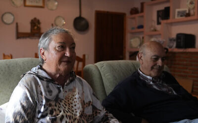 The parents of Santiago Sanchez Cogedor, Celia Cogedor, left and Santiago Sanchez speak during an interview with The Associated Press in their home in Henches, Spain, October 24, 2022. (AP Photo/Paul White)