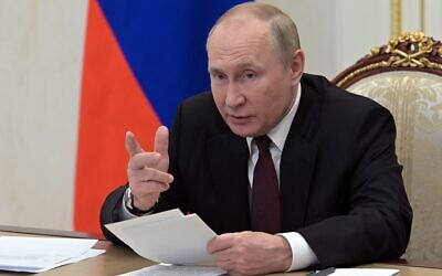 Russian President Vladimir Putin chairs a meeting with the heads of delegations of the Conference of Heads of Security and Intelligence Agencies of the Commonwealth of Independent States countries via a videoconference at the Kremlin in Moscow, Russia, October 26, 2022. (Alexei Babushkin, Sputnik, Kremlin Pool Photo via AP)