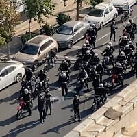 In this frame grab, from video taken by an individual not employed by The Associated Press and obtained by the AP outside Iran, Iranian police arrive to disperse a protest to mark 40 days since the death in morality police custody of 22-year-old Iranian Kurdish woman Mahsa Amini, in Tehran, Iran, October 26, 2022. (AP Photo)