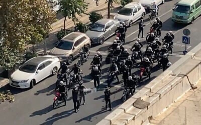 In this frame grab, from video taken by an individual not employed by The Associated Press and obtained by the AP outside Iran, Iranian police arrive to disperse a protest to mark 40 days since the death in morality police custody of 22-year-old Iranian Kurdish woman Mahsa Amini, in Tehran, Iran, October 26, 2022. (AP Photo)