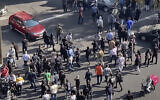 In this frame grab from video taken by an individual not employed by the Associated Press and obtained by the AP outside Iran shows people block an intersection during a protest to mark 40 days since the death in custody of 22-year-old Mahsa Amini, whose tragedy sparked Iran's biggest anti-government movement in over a decade, in Tehran, Iran, October 26, 2022. (AP Photo)