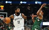 Brooklyn Nets' Kyrie Irving tries to get past Milwaukee Bucks' George Hill during the first half of an NBA basketball game, October 26, 2022, in Milwaukee. (AP Photo/Morry Gash)