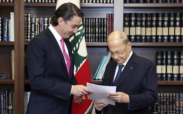 In this photo released by Lebanon's official government photographer Dalati Nohra, Lebanese President Michel Aoun, right, receives from US Envoy for Energy Affairs Amos Hochstein, the US-brokered deal setting a maritime border between Lebanon and Israel, at the presidential palace, in Beirut, Lebanon, Thursday, Oct. 27, 2022. (Dalati Nohra via AP) In this photo released by Lebanon's official government photographer Dalati Nohra, Lebanese President Michel Aoun, right, receives from US Envoy for Energy Affairs Amos Hochstein, the US-brokered deal setting a maritime border between Lebanon and Israel, at the presidential palace, in Beirut, Lebanon, Thursday, Oct. 27, 2022. (Dalati Nohra via AP)