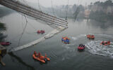 Search and rescue work is going on as a cable suspension bridge collapsed in Morbi town of western state Gujarat, India, Monday, Oct. 31, 2022. (AP/Ajit Solanki)