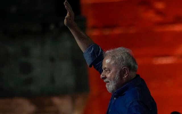 Former Brazilian president Luiz Inacio Lula waves to supporters gathered on Paulista Av. after he defeated incumbent Jair Bolsonaro in a presidential run-off election to become the country's next president, in Sao Paulo, Brazil, October 30, 2022. (AP Photo/Andre Penner)