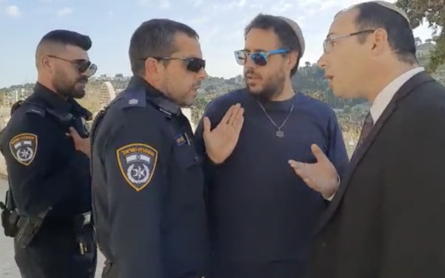 Religious Zionism MK Simcha Rothman remonstrates with a police officer for arresting Temple Mount activist Emanuel Brosh at the Eastern Wall of the Temple Mount on October 2, 2022. (Courtesy Arnon Segal) Religious Zionism MK Simcha Rothman remonstrates with a police officer for arresting Temple Mount activist Emanuel Brosh at the Eastern Wall of the Temple Mount on October 2, 2022. (Courtesy Arnon Segal)