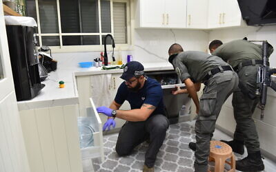 Police search the home of one of six suspects arrest on suspicion of involvement in the killing of Arab Israeli journalist Nidal Agbaria, October 26, 2022. (Israel Police)