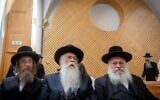 United Torah Judaism chairman Yitzchak Goldknopf and MKs Ya'akov Tessler and Meir Porush arrive for a court hearing on a petition against the kosher cell phone reform, at the Supreme Court in Jerusalem, July 28, 2022. (Yonatan Sindel/Flash90)