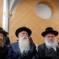 United Torah Judaism chairman Yitzhak Goldknopf and MKs Ya'akov Tessler and Meir Porush arrive for a court hearing on a petition against the kosher cellphone reform, at the Supreme Court in Jerusalem, July 28, 2022. (Yonatan Sindel/Flash90)