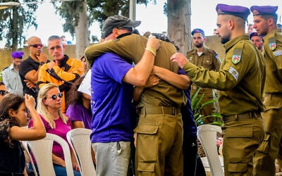 Hundreds of people attend the funeral ceremony of Staff Sgt. Ido Baruch killed in a shooting attack in the West Bank yesterday, at the military cemetery in Gedera, October 12, 2022. (Avshalom Sassoni/Flash90)