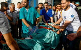 Wounded Palestinians who were injured during clashes with Israeli security forces in the town of Qarawat Bani Hassan, arrive at a hospital, October 15, 2022. (Nasser Ishtayeh/Flash90)