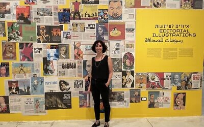 Tal Lanir, curator of 'Illustrations: David Polonsky' at the Tel Aviv Museum of Art through February 18, 2023. (Jessica Steinberg/Times of Israel)