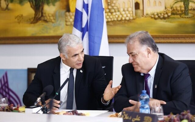 Prime Minister Yair Lapid (L) meets with Nazareth Mayor Ali Salem during a visit to the northern city on October 25, 2022. (Kobi Wolf) Prime Minister Yair Lapid (L) meets with Nazareth Mayor Ali Salem during a visit to the northern city on October 25, 2022. (Kobi Wolf)