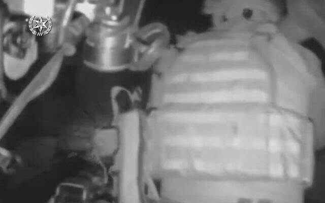 In this screen capture of headcam footage, Israeli police commandos fire grenades during a raid on an explosives workshop in the northern West Bank city of Nablus, October 25, 2022. (Screen capture: Twitter)