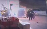 The Palestinian perpetrator of a shooting terror attack near Kiryat Arba in the West Bank is seen in CCTV footage, moment before he is rammed by a security officer and shot dead by an off-duty soldier, October 29, 2022. (Screenshot; used in accordance with Clause 27a of the Copyright Law)
