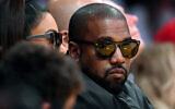 File: Kanye West watches an NBA basketball game in Los Angeles, January 13, 2020. (AP Photo/Mark J. Terrill)