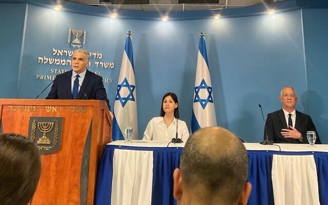Prime Minister Yair Lapid (L), alongside Energy Minister Karine Elharrar (C) and Defense Minister Benny Gantz, speak to the press in Jerusalem about the Israel-Lebanon maritime border deal, October 12, 2022 (Lazar Berman/Times of Israel) Prime Minister Yair Lapid (L), alongside Energy Minister Karine Elharrar (C) and Defense Minister Benny Gantz, speak to the press in Jerusalem about the Israel-Lebanon maritime border deal, October 12, 2022 (Lazar Berman/Times of Israel)
