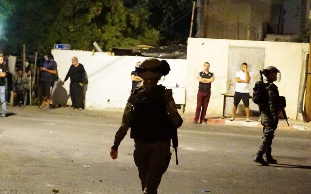 Police officers are seen in East Jerusalem's Sheikh Jarrah neighborhood following a clash, October 13, 2022. (Israel Police) Police officers are seen in East Jerusalem's Sheikh Jarrah neighborhood following a clash, October 13, 2022. (Israel Police)