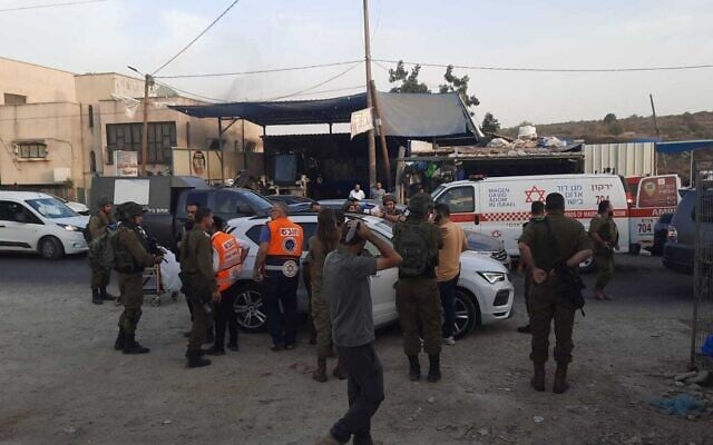 Israeli troops and medics are seen at the scene of stabbing in the West Bank village of al-Funduq, October 25, 2022. (Courtesy) Israeli troops and medics are seen at the scene of stabbing in the West Bank village of al-Funduq, October 25, 2022. (Courtesy)