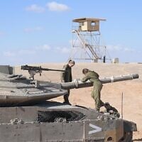 Female soldiers operate a tank in the Negev Desert, in an undated photograph. (Israel Defense Forces)