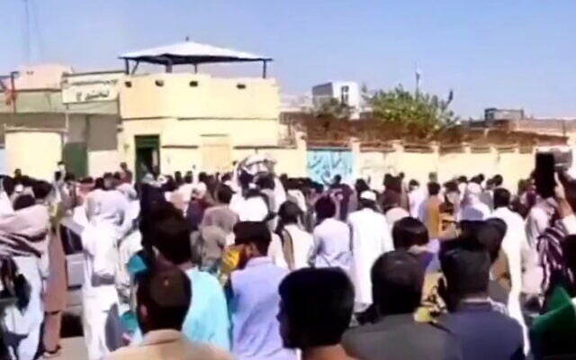Iranians hurl stones at police station in Zahedan on September 30, 2022. (Screen capture: Twitter) Iranians hurl stones at police station in Zahedan on September 30, 2022. (Screen capture: Twitter)