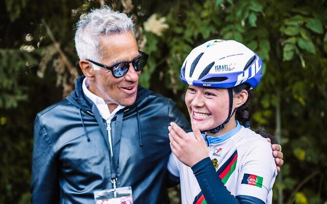 Afghanistan's national cycling champion Fariba Hashimi (R) meets the owner of Women’s WorldTour team Israel – Premier Tech Roland, Sylvan Adams, in Aigle, Switzerland, October 23, 2022. (Noa Arnon/courtesy) Afghanistan's national cycling champion Fariba Hashimi (R) meets the owner of Women’s WorldTour team Israel – Premier Tech Roland, Sylvan Adams, in Aigle, Switzerland, October 23, 2022. (Noa Arnon/courtesy)