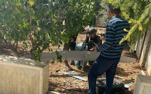 Israeli soldiers retreive a Skylark drone that crashed in the West Bank city of Hebron, October 19, 2022. (Social media: used in accordance with Clause 27a of the Copyright Law) Israeli soldiers retreive a Skylark drone that crashed in the West Bank city of Hebron, October 19, 2022. (Social media: used in accordance with Clause 27a of the Copyright Law)