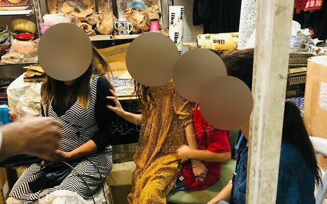 A photo circulating on social media of an Israeli woman and her three children who entered the Palestinian city of Nablus in the West Bank on October 4, 2022, hours before Yom Kippur. They were detained and escorted out of the city by Palestinian security forces. (Photo via Twitter, @bani_basel; used in accordance with clause 27a of the Copyright Law)
