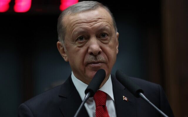 Turkish President Recep Tayyip Erdogan greets MPs during his Justice and Development party's group meeting at the Turkish Grand National Assembly in Ankara, Turkey, on November 2, 2022. (Adem Altan/AFP)
