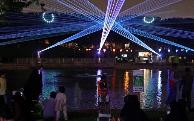 Saudis attend the Noor Riyadh lighting festival held at Al-Salam Park in the Saudi capital Riyadh, November 3, 2022. (Fayez Nureldine / AFP)