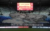 A giant banner unfurled by Lazio fans, reading 'my love will not die' is displayed in a tribune prior to the Italian Serie A football match between AS Rome and Lazio on November 6, 2022 at the Olympic stadium in Rome. (Tiziana FABI / AFP)