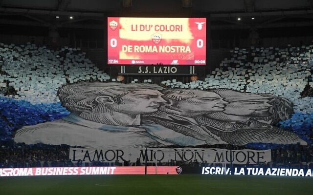 A giant banner unfurled by Lazio fans, reading 'my love will not die' is displayed in a tribune prior to the Italian Serie A football match between AS Rome and Lazio on November 6, 2022 at the Olympic stadium in Rome. (Tiziana FABI / AFP) A giant banner unfurled by Lazio fans, reading 'my love will not die' is displayed in a tribune prior to the Italian Serie A football match between AS Rome and Lazio on November 6, 2022 at the Olympic stadium in Rome. (Tiziana FABI / AFP)