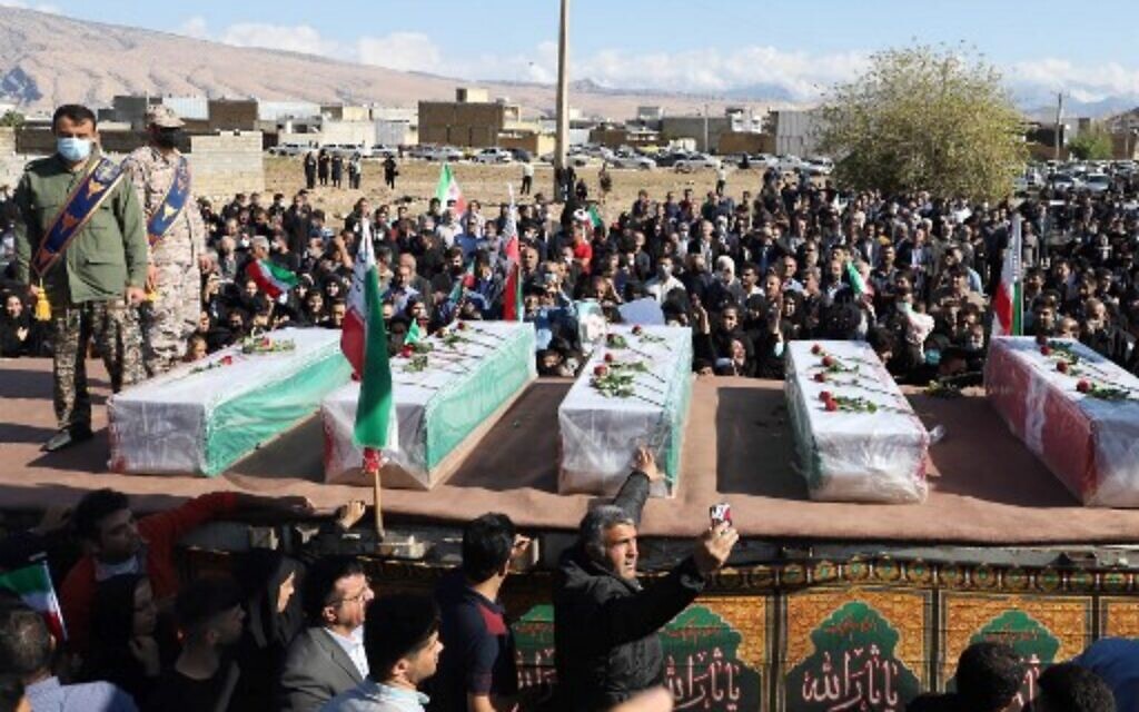 Iranians mourn in front of the coffins during a funeral for people killed in a shooting attack, in the city of Izeh in Iran's Khuzestan province, on November 18, 2022. (ALIREZA MOHAMMADI/isna/AFP) Iranians mourn in front of the coffins during a funeral for people killed in a shooting attack, in the city of Izeh in Iran's Khuzestan province, on November 18, 2022. (ALIREZA MOHAMMADI/isna/AFP)
