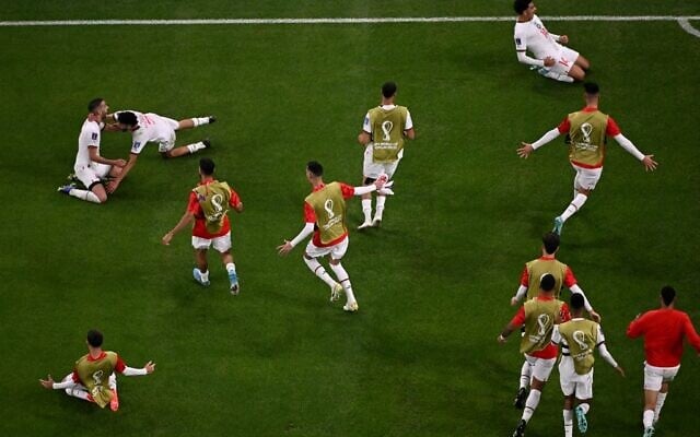 Morocco's forward #14 Zakaria Aboukhlal (top, R) celebrates with teammates after he scored his team's second goal during the Qatar 2022 World Cup Group F football match between Belgium and Morocco at the Al-Thumama Stadium in Doha on November 27, 2022. (Kirill KUDRYAVTSEV / AFP) Morocco's forward #14 Zakaria Aboukhlal (top, R) celebrates with teammates after he scored his team's second goal during the Qatar 2022 World Cup Group F football match between Belgium and Morocco at the Al-Thumama Stadium in Doha on November 27, 2022. (Kirill KUDRYAVTSEV / AFP)