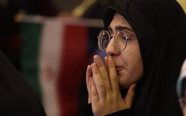 An Iranian fan reacts after watching the Iran National team lose the Qatar 2022 World Cup Group B football match between the United States and Iran, being shown at Milad Tower in the capital Tehran, on November 29, 2022. (ATTA KENARE / AFP) An Iranian fan reacts after watching the Iran National team lose the Qatar 2022 World Cup Group B football match between the United States and Iran, being shown at Milad Tower in the capital Tehran, on November 29, 2022. (ATTA KENARE / AFP)