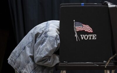 A person votes at a polling location at Indianola Church of Christ on US Election Day on November 8, 2022 in Columbus, Ohio. (Drew Angerer/Getty Images/AFP)