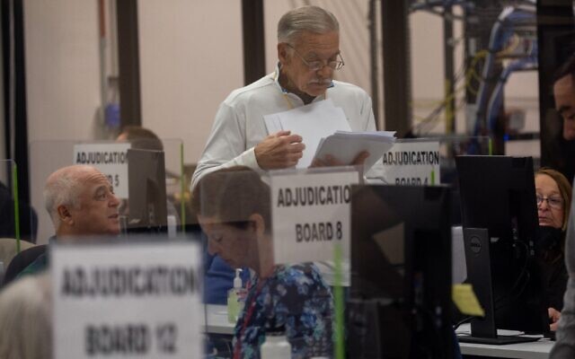 An adjudication board reviews ballots at the Maricopa County Tabulation and Election Center on November 8, 2022 in Phoenix, Arizona. (John Moore/Getty Images/AFP) An adjudication board reviews ballots at the Maricopa County Tabulation and Election Center on November 8, 2022 in Phoenix, Arizona. (John Moore/Getty Images/AFP)