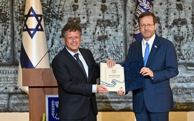 President Isaac Herzog receives the official results of the November 1, 2022 elections from Central Elections Committee chair Justice Isaac Amit, November 9, 2022 (President's Residence)