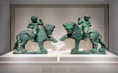 Striding lions with Eros child (pair of two). Early 1st century BCE- mid 1st century CE, Yemen, bronze. (Courtesy of Smithsonian/ Colleen Dugan)