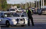 Illustrative -- A police officer stops a vehicle at a check point on March 20, 2018, in Schertz, Texas  (AP Photo/Eric Gay)