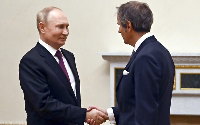 Russian President Vladimir Putin, left, and International Atomic Energy Agency (IAEA) Director General Rafael Mariano Grossi greet each other during their meeting in St. Petersburg, Russia, October 11, 2022. (Pavel Bednyakov, Sputnik, Kremlin Pool Photo via AP) Russian President Vladimir Putin, left, and International Atomic Energy Agency (IAEA) Director General Rafael Mariano Grossi greet each other during their meeting in St. Petersburg, Russia, October 11, 2022. (Pavel Bednyakov, Sputnik, Kremlin Pool Photo via AP)