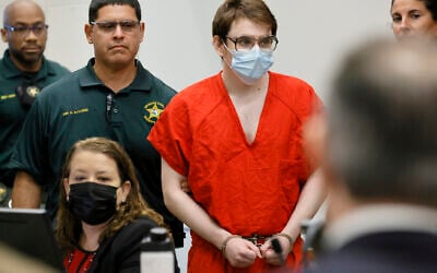 Marjory Stoneman Douglas High School shooter Nikolas Cruz is escorted into the courtroom for a hearing regarding possible jury misconduct during deliberations in the penalty phase of his trial on Friday, Oct. 14, 2022, at the Broward County Courthouse in Fort Lauderdale, Florida. (Amy Beth Bennett/South Florida Sun Sentinel via AP, Pool)