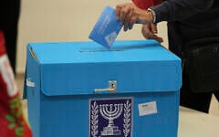 A voter casts a ballot in Tel Aviv during Israel's parliamentary elections on November 1, 2022. (Jack Guez/Pool Photo via AP)