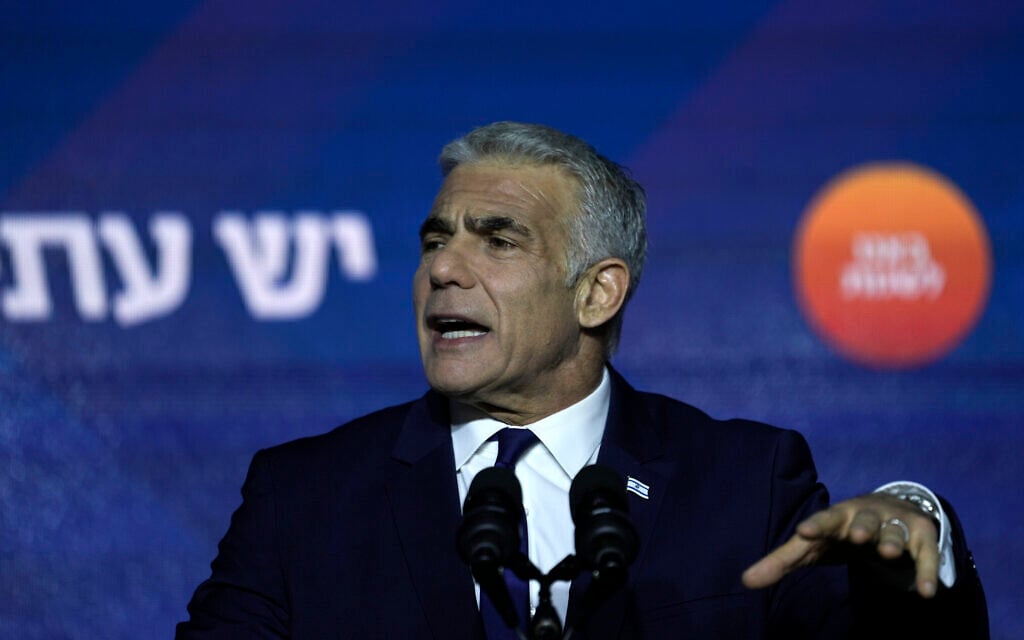 Prime Minister and the head of Yesh Atid party, Yair Lapid, speaks to his supporters after the publication of exit polls, at his party's headquarters in Tel Aviv, November 2, 2022. (AP Photo/Ariel Schalit)