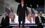 Former US president Donald Trump arrives at a rally, Thursday, Nov. 3, 2022, in Sioux City, Iowa. (AP Photo/Charlie Neibergall)