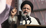 Iranian President Ebrahim Raisi addresses the crowd during an annual demonstration in front of the former US Embassy in Tehran, Iran, November 4, 2022. (AP Photo/Vahid Salemi)