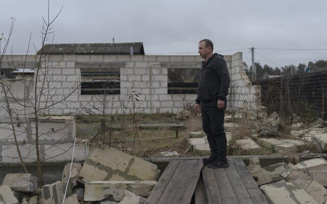 Vadym Zherdetsky stands amid the wreckage of his house destroyed by fighting in the village of Moshun, outside Kyiv, Ukraine, November 4, 2022. (AP Photo/ Andrew Kravchenko) Vadym Zherdetsky stands amid the wreckage of his house destroyed by fighting in the village of Moshun, outside Kyiv, Ukraine, November 4, 2022. (AP Photo/ Andrew Kravchenko)